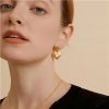 boucles d'oreilles cœur avec pierre blanche