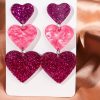 boucles d'oreilles en cœur pourpre